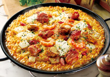 Mixed paella with white sauce,  mascarpone and cheddar cheese